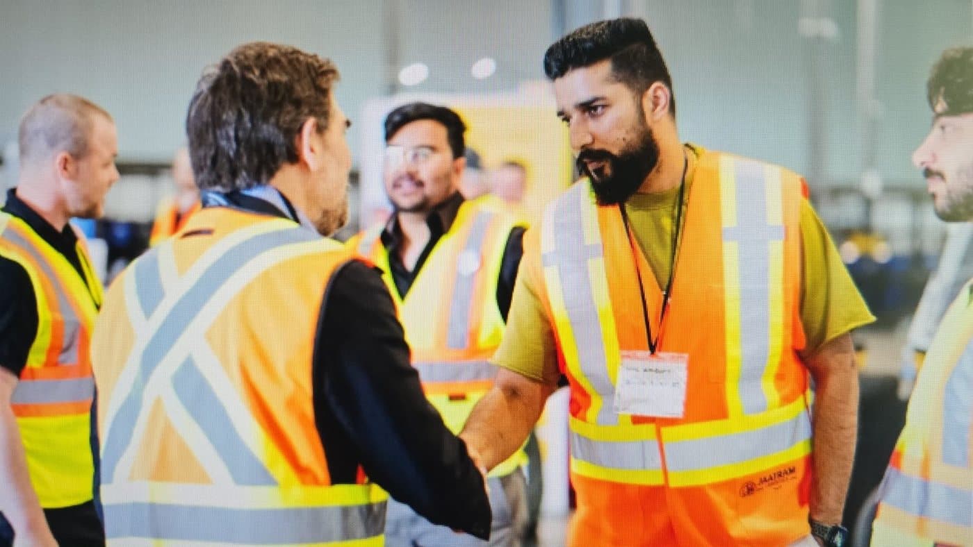 Sahil, Founder of Jaatram Logistics, meeting delivery partners on the floor at a Dragonfly station